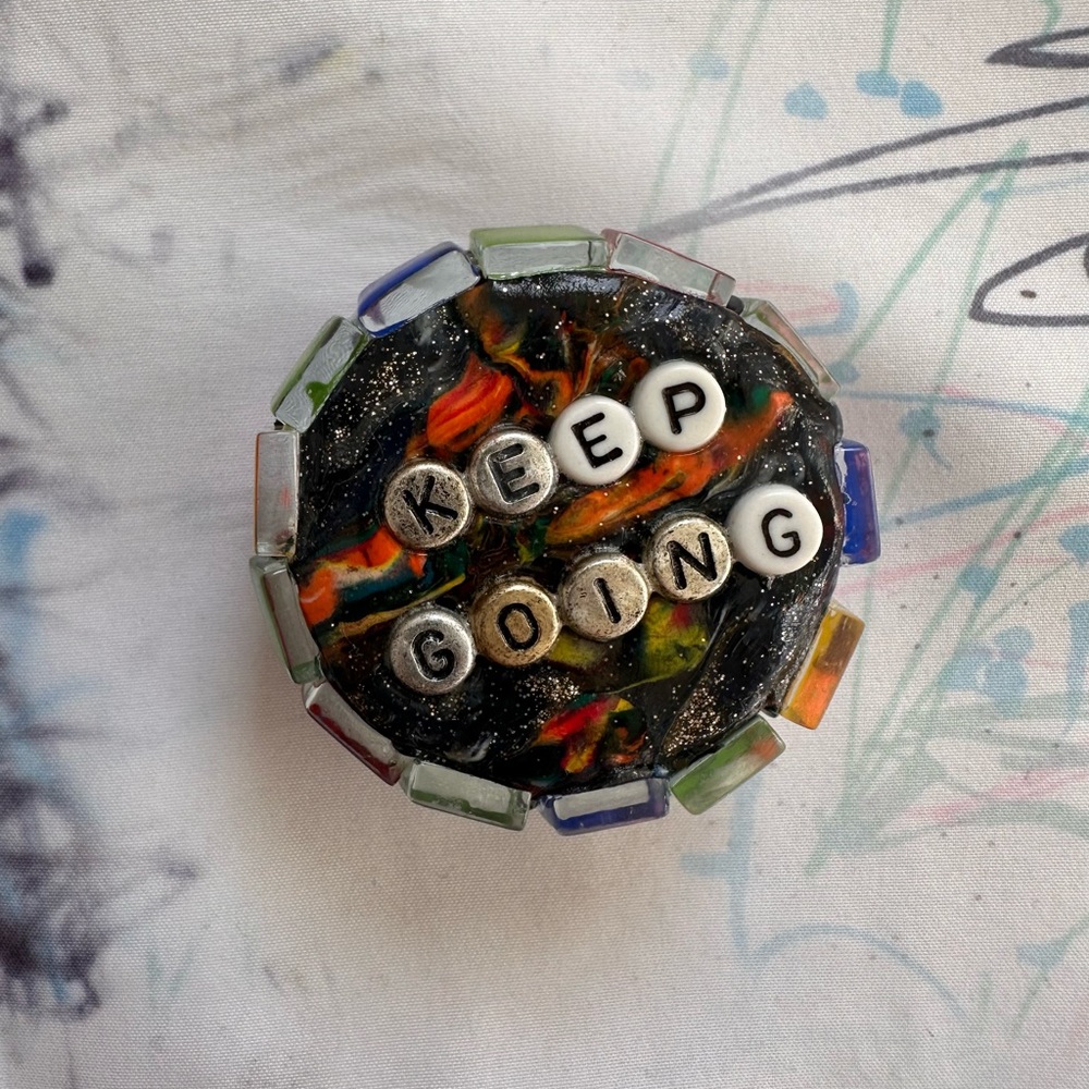 Handmade tin. “Keep Going” made with the loving helping hand of my son.